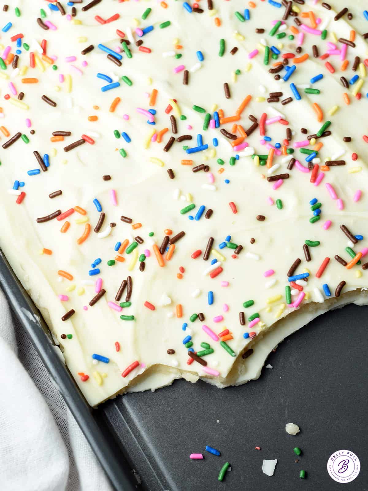 chocolate bark with sprinkles on cookie sheet tray