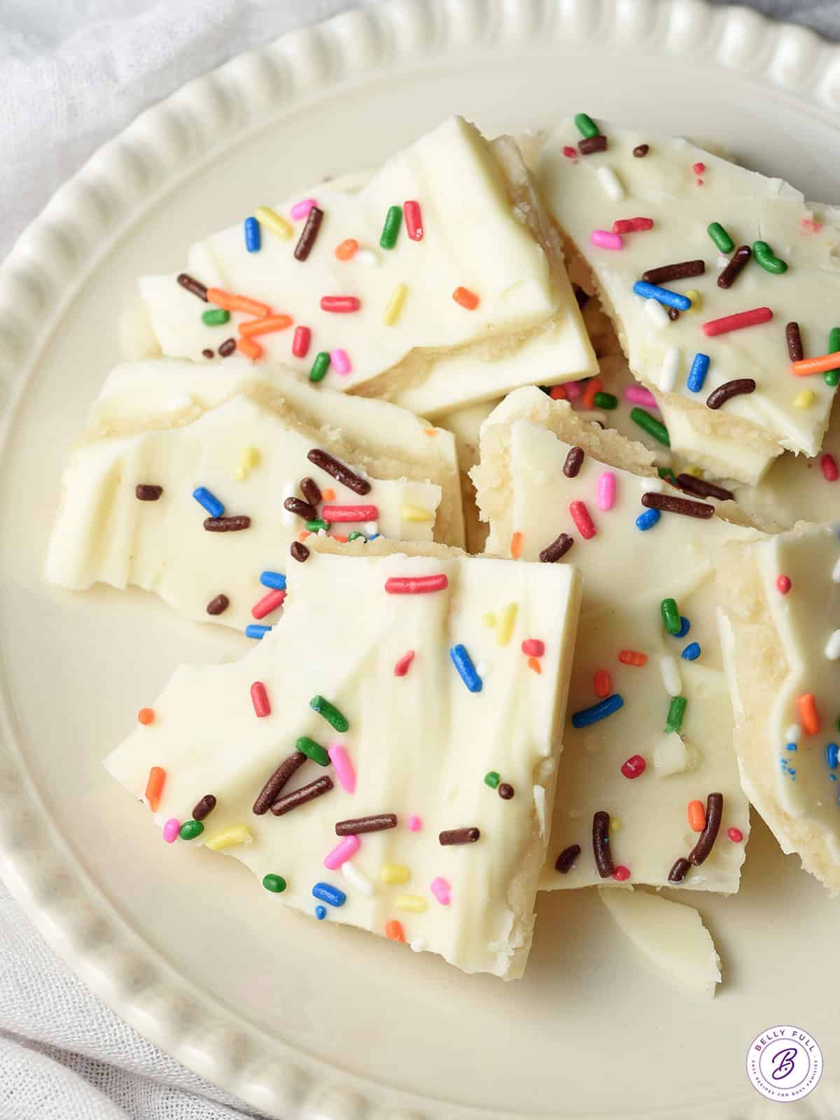 overhead broken pieces of chocolate cookie bark on plate