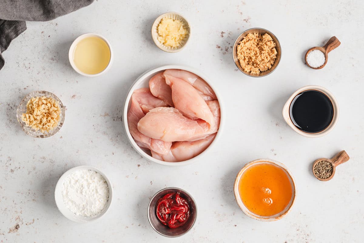 Ingredients to make sweet and spicy sticky chicken. 
