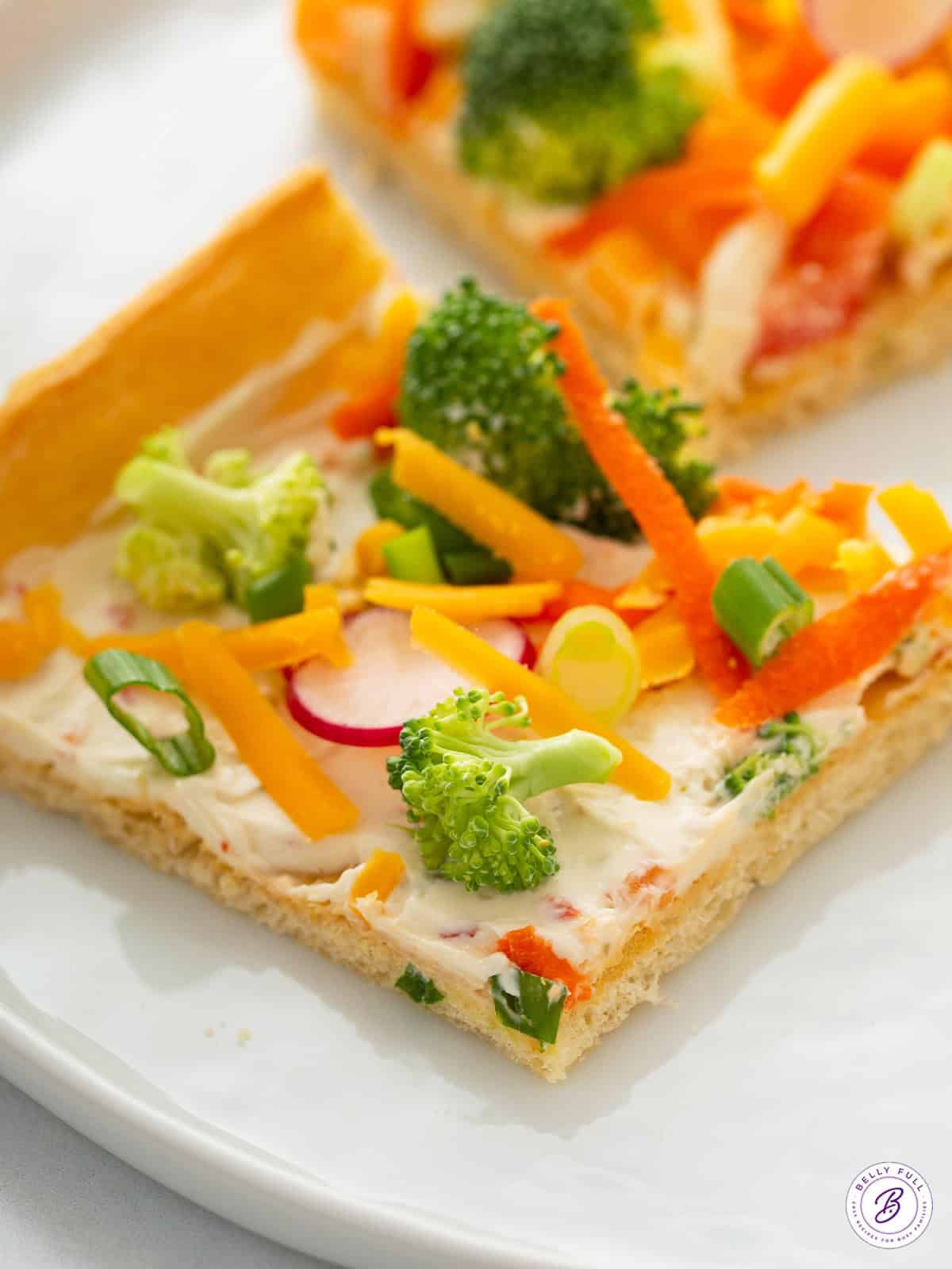 slice of Pillsbury cream cheese veggie pizza