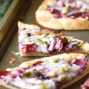 wedge of Hot Pastrami Flatbread on baking sheet