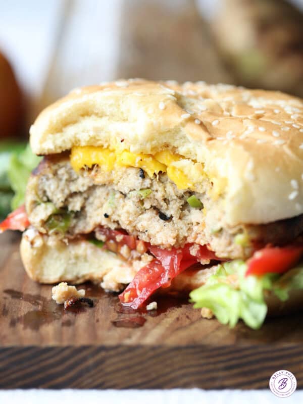bite taken from juicy turkey burger