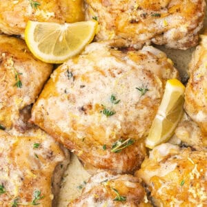 overhead close up chicken thigh with skin in lemon cream sauce
