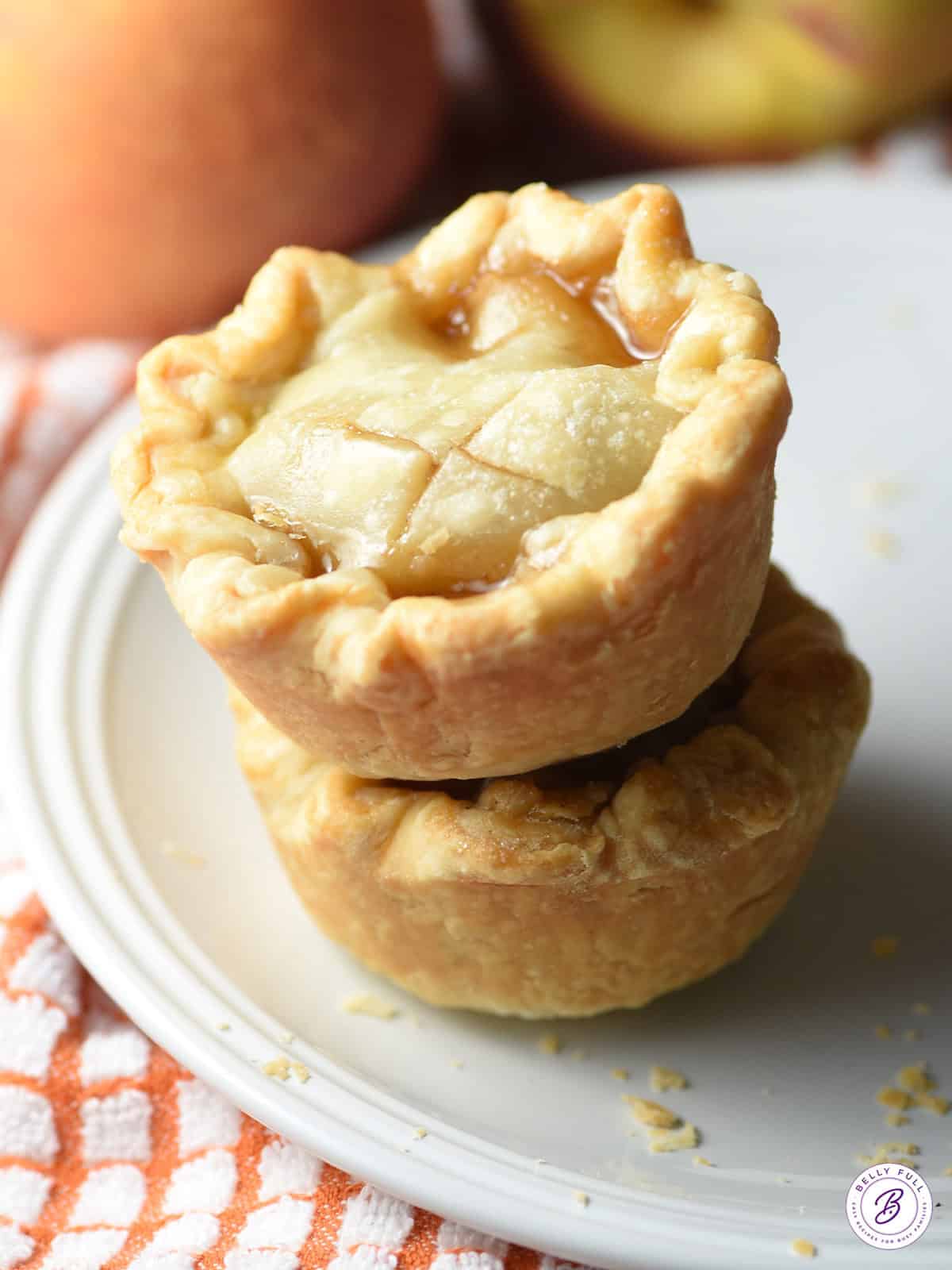 2 mini peach pies stacked on plate