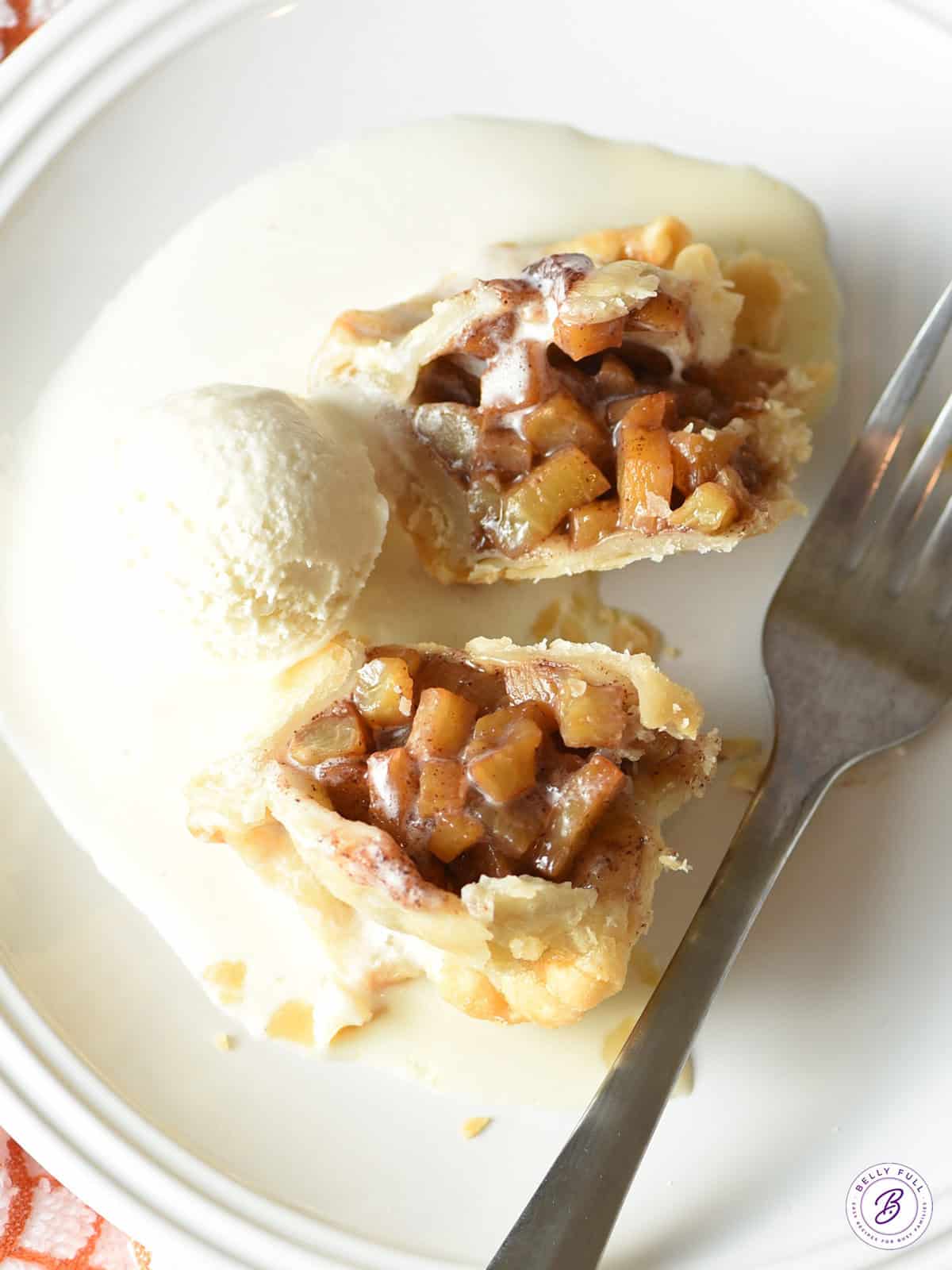 overhead baked hand peach pie split in half