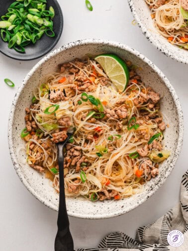 Overhead view of a bowl of Filipino pancit