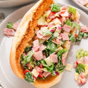 An Italian chopped salad sandwich on a plate