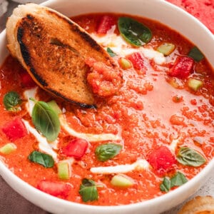 bowl of watermelon gazpacho with crusty bread