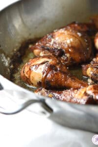 chicken legs and thighs in skillet with lemon and balsamic vinegar glaze