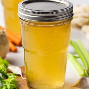 A mason jar of homemade chicken stock