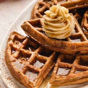 plate of cinnamon waffles with whipped maple butter