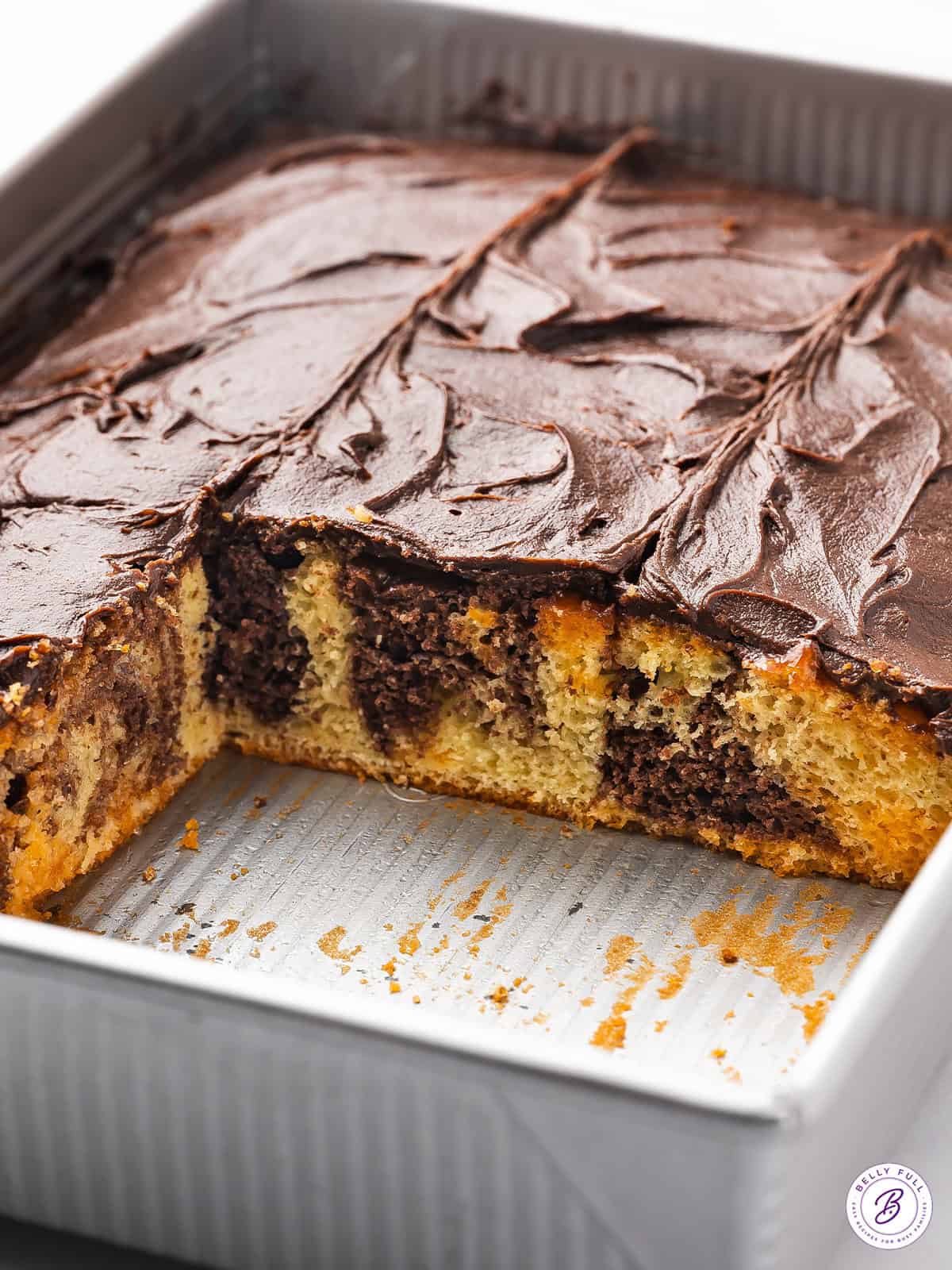 frosted marble fudge cake in baking dish