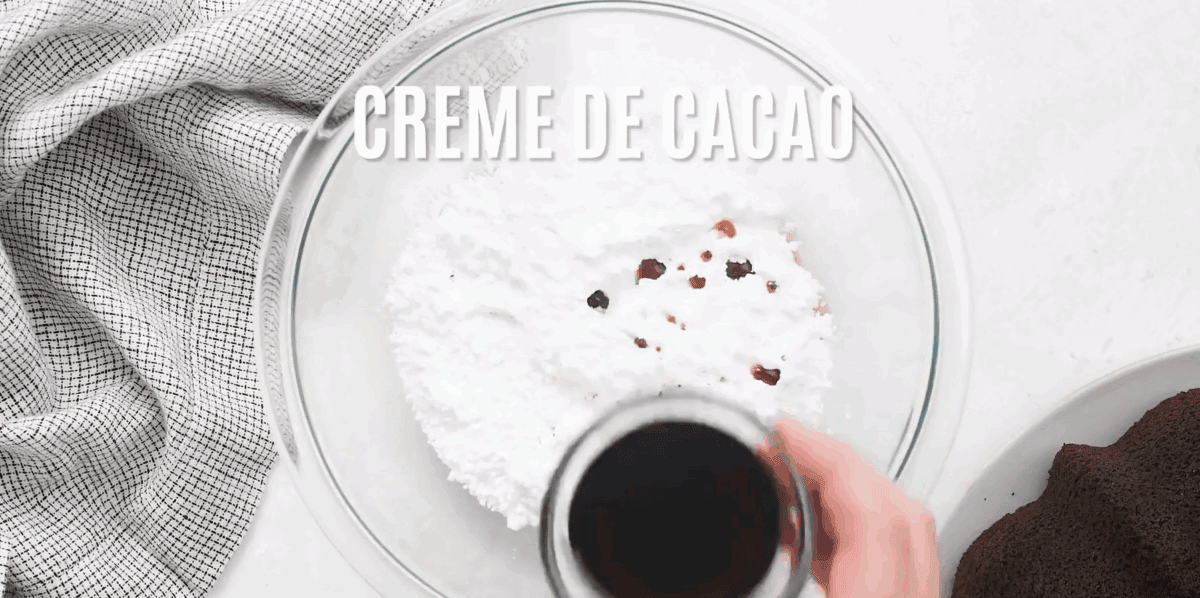 Combining the ingredients to make the icing in a glass bowl.