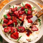 A bowl of whipped feta with balsamic strawberries