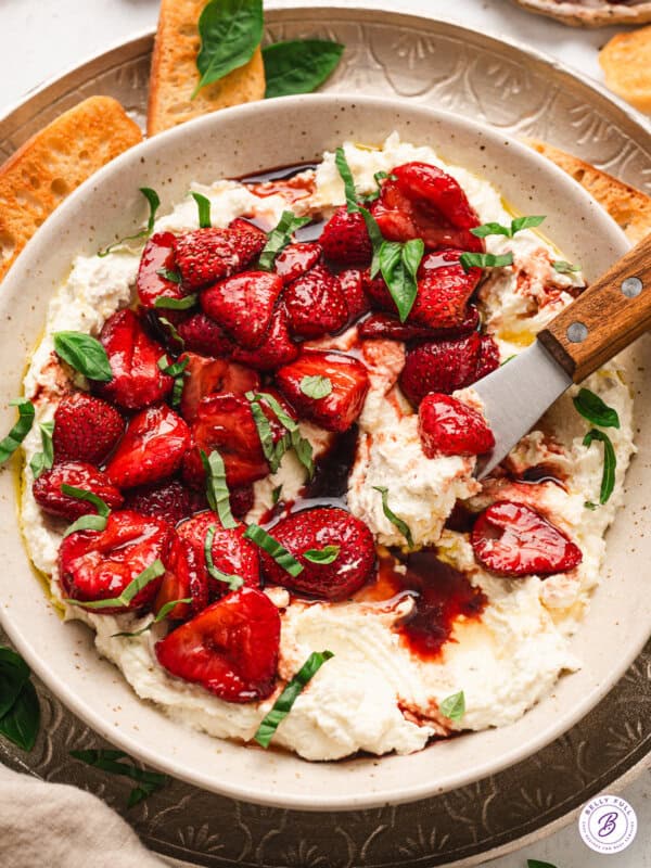 A bowl of whipped feta with balsamic strawberries