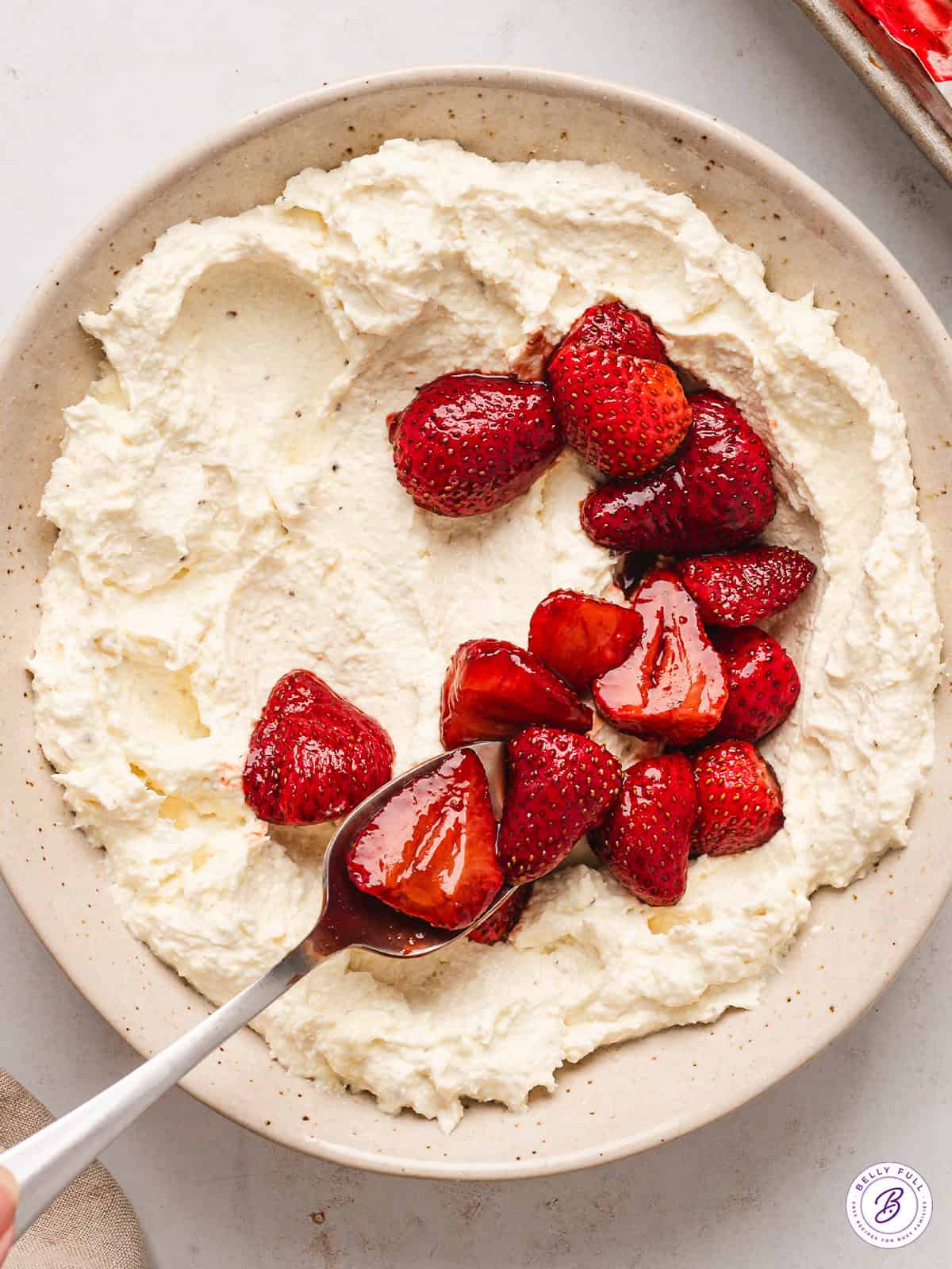 This Creamy Whipped Feta Dip recipe is made with just a few ingredients blended until smooth, light, and creamy. A bowl of whipped feta cheese dip with strawberries
