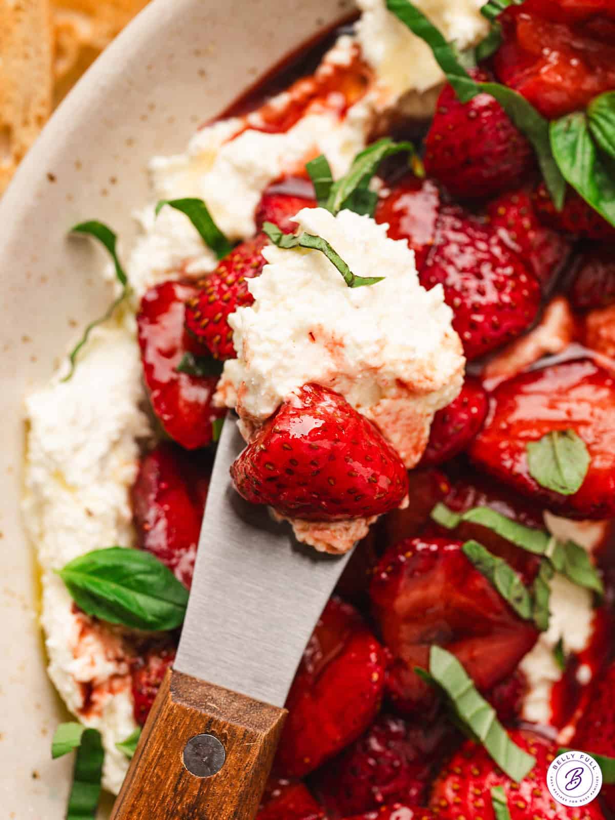 This Creamy Whipped Feta Dip recipe is made with just a few ingredients blended until smooth, light, and creamy. Whipped feta on a knife