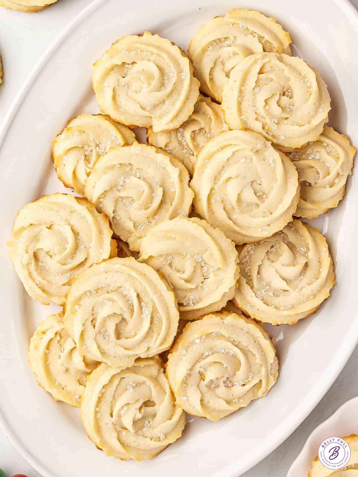 Overhead view of a butter cookies on a oval shaped serving dish.