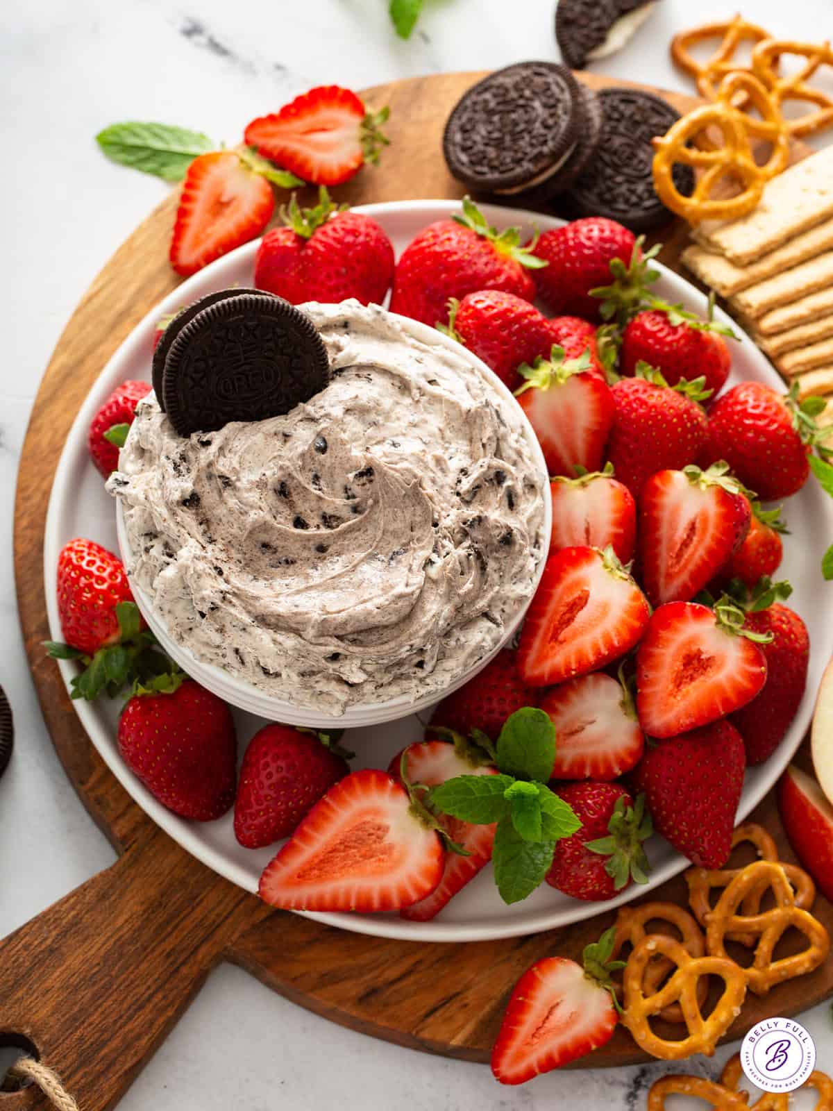 overhead cookies and cream dip with strawberries and pretzels