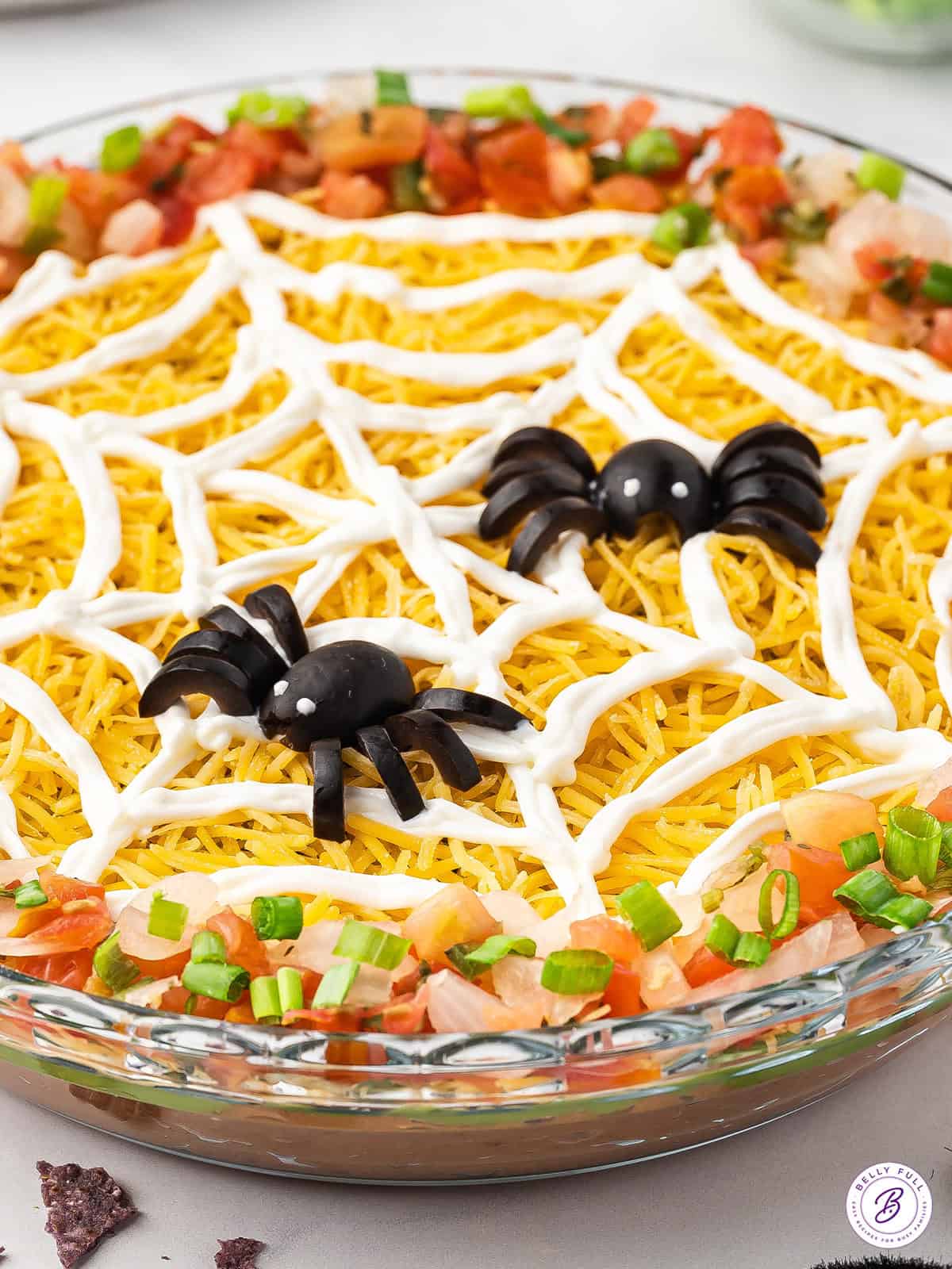 black olive spiders on top of sour cream spiderweb