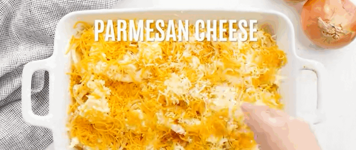 Sprinkling cheese over the onions.