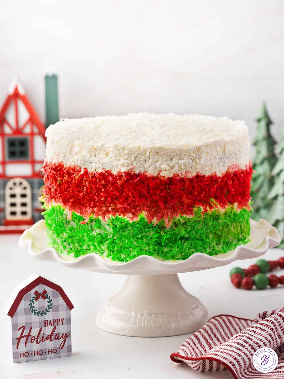 A Christmas layer cake on a pedestal