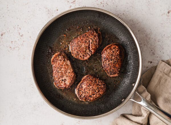 Beef tenderloin steaks in a skillet