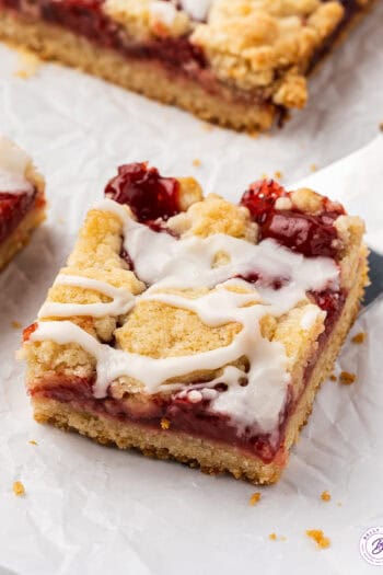 A cherry pie bar on a serving spatula