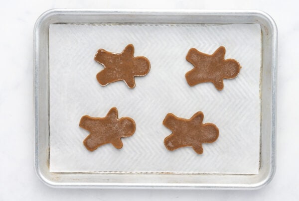 unbaked Gingerbread man cookies on a baking sheet