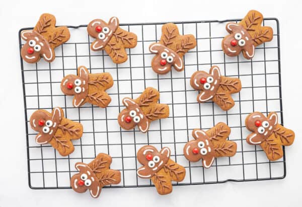 decorated reindeer gingerbread cookies on wire rack