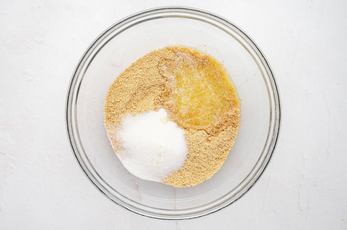 butter and sugar added to graham cracker crumsb to make pie crust