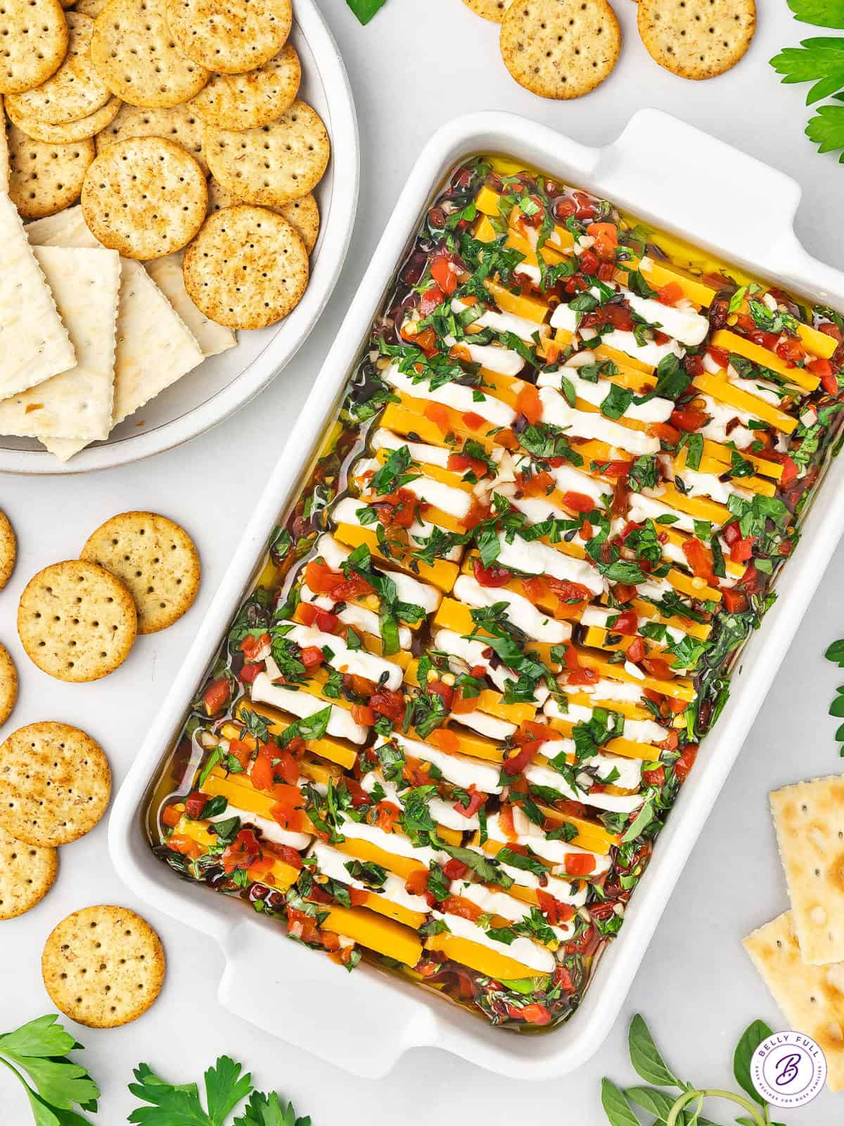 Overhead view of a baking dish of marinated cheese