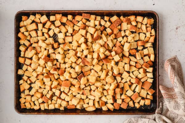 Cubes of potato bread on a baking sheet