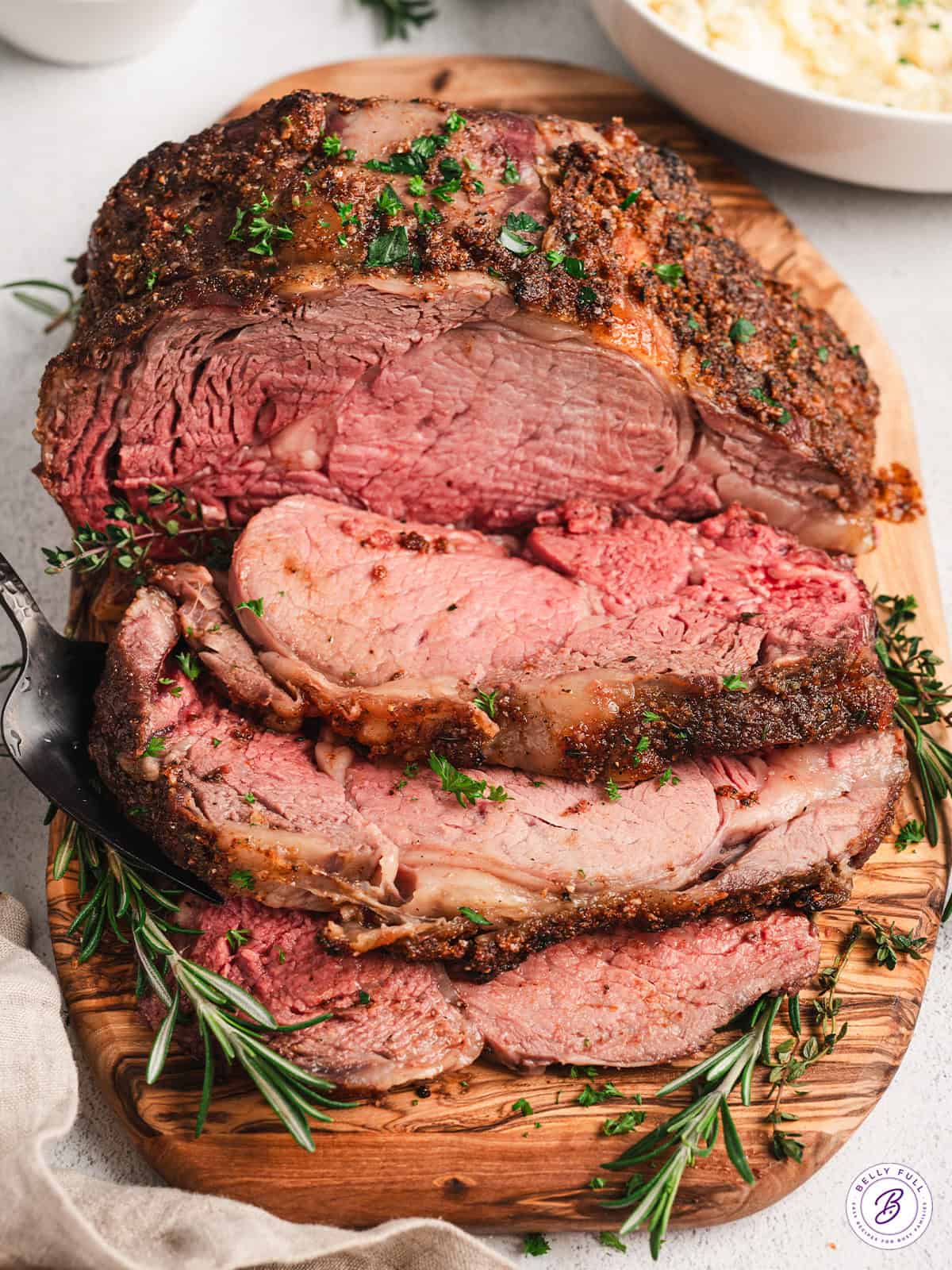 Overhead view of a sliced roasted prime rib.