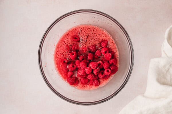 Frozen raspberries mixed into raspberry jello