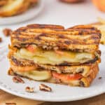 2 stacked halves of roasted apple and brie panini