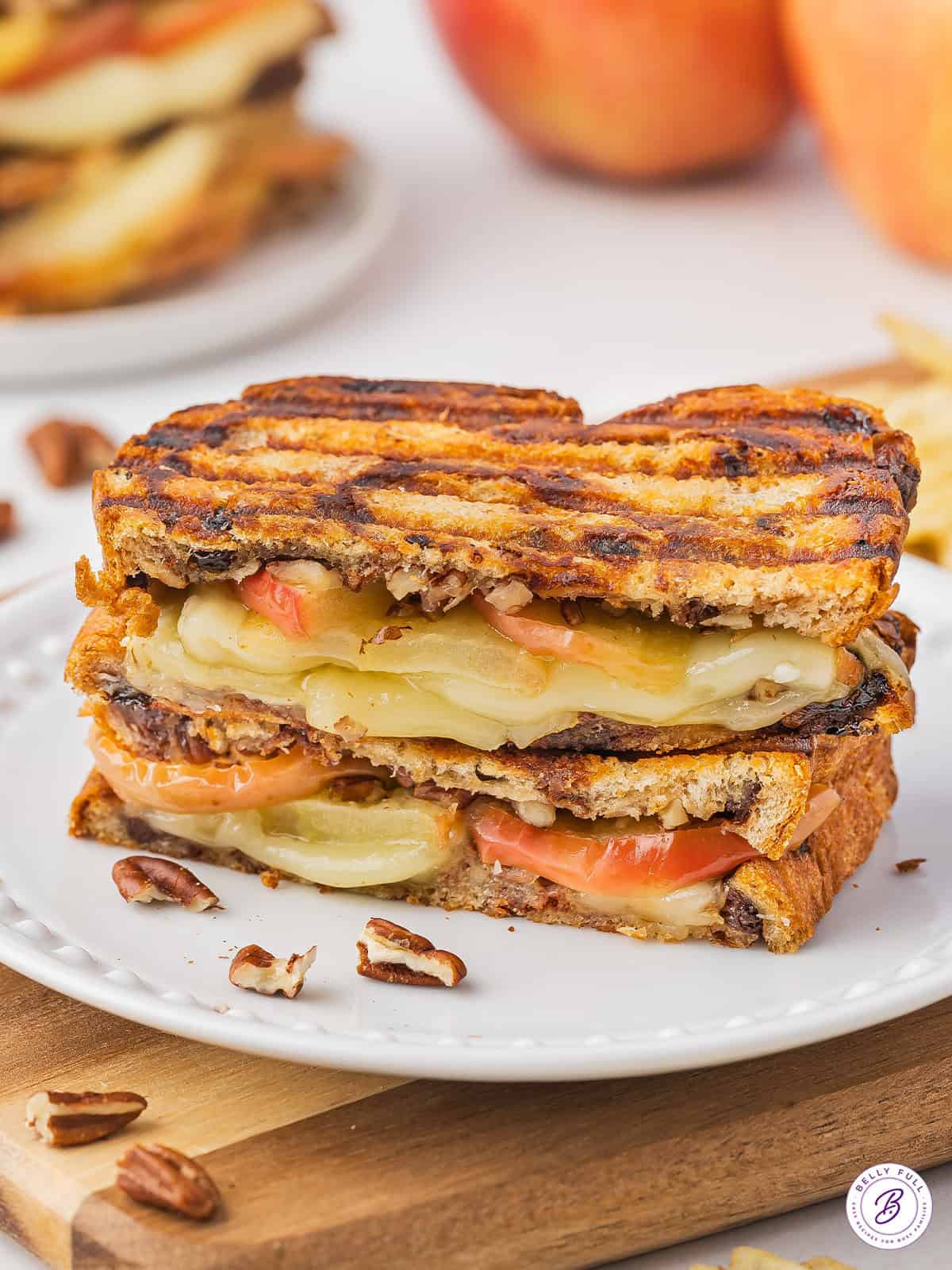 2 stacked halves of roasted apple and brie panini