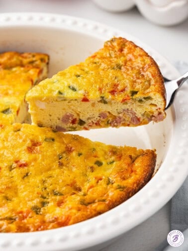 Serving a slice of baked omelet