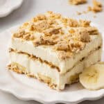 square slice of banana cream lush dessert on plate