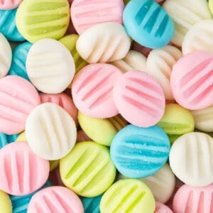 close up pastel colored cream cheese button mints