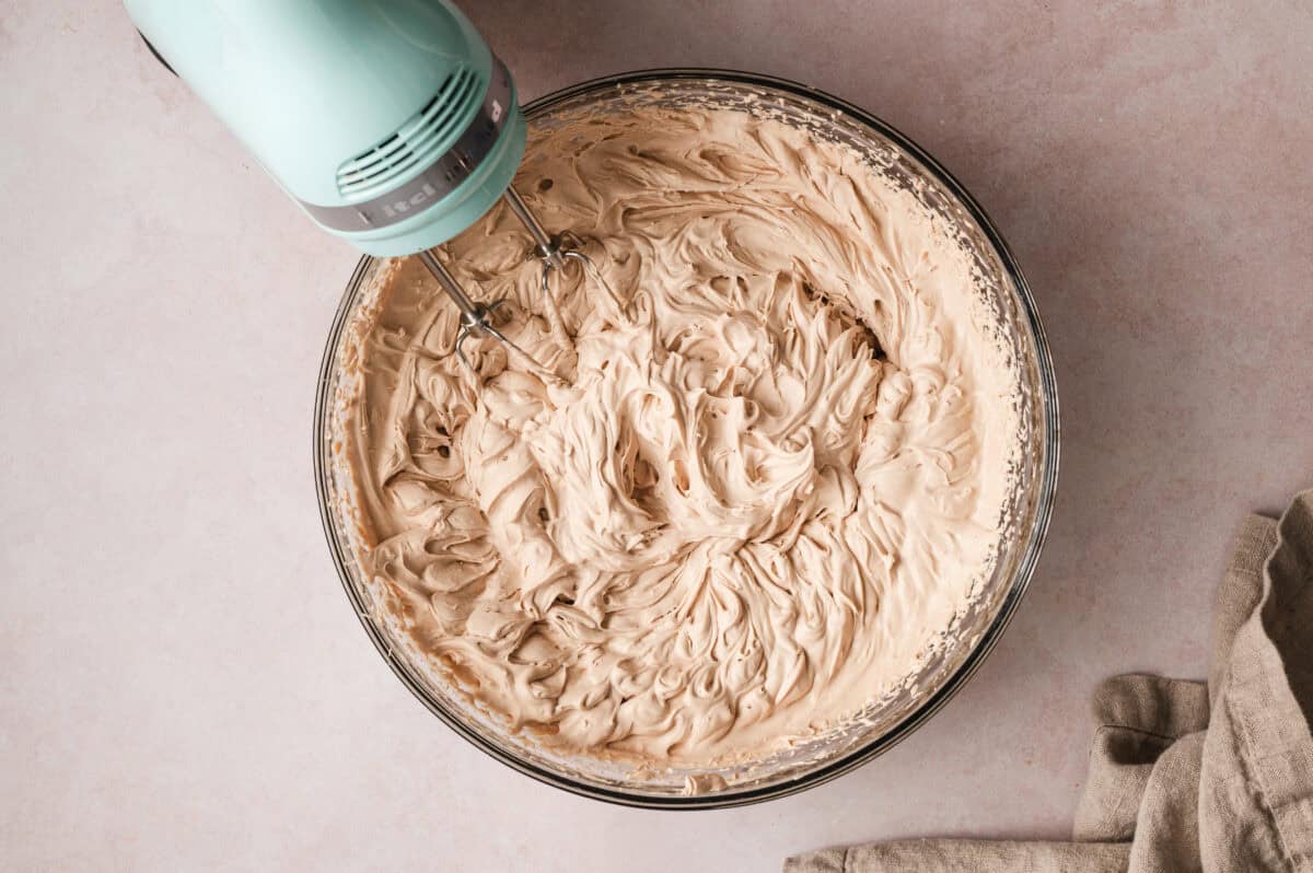fluffy mocha flavored whipped cream in mixing bowl