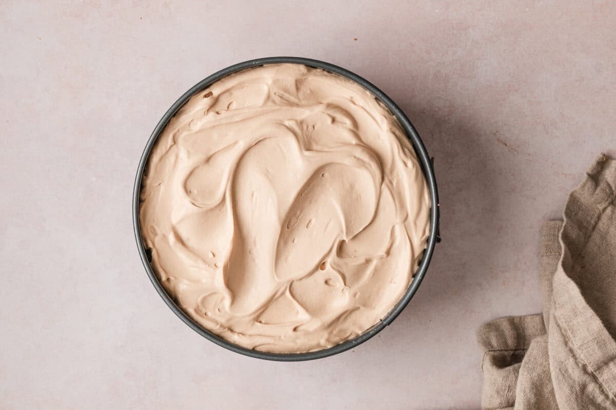 overhead layer of mocha whipped cream in springform pan