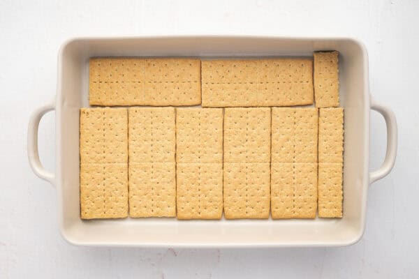 a layer of graham crackers sheets in the bottom of a casserole dish