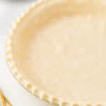 unbaked pie crust with crimped edges