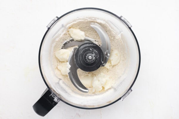 flour and vegetable shortening in bowl of food processor