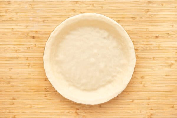 unbaked pie crust dough formed in pie plate