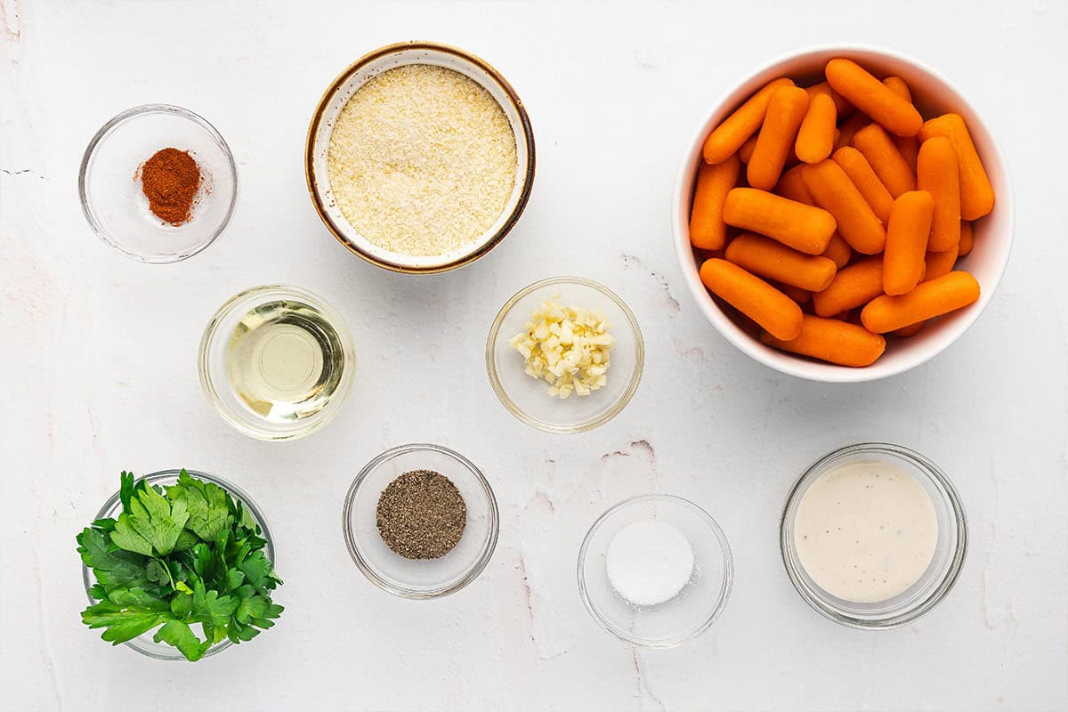 Overhead view of ingredients needed to make parmesan smashed carrots