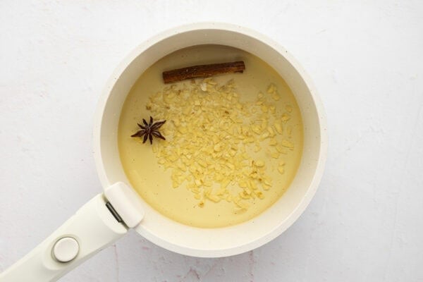 Garlic, cinnamon, and star anise in oil