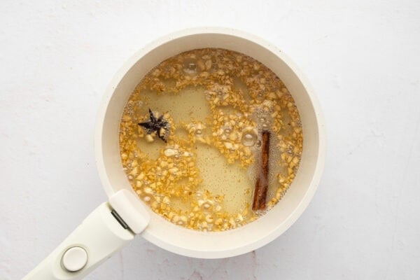 Sauteed garlic, cinnamon, and star anise in a bowl