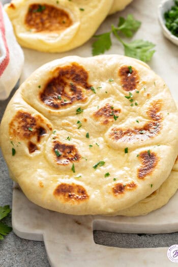 warm homemade naan with garlic, butter, and parsley